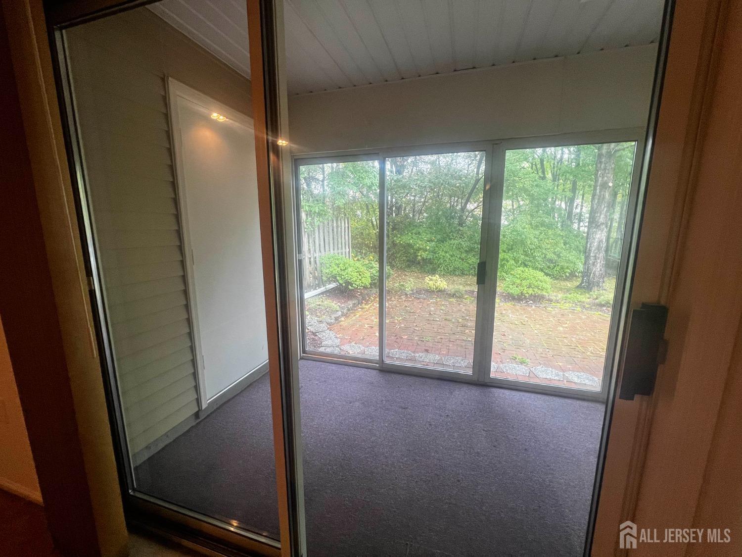 143 Archery Court Old Bridge, NJ 08857 - Photo 22 of 29 a view of a glass door and porch
