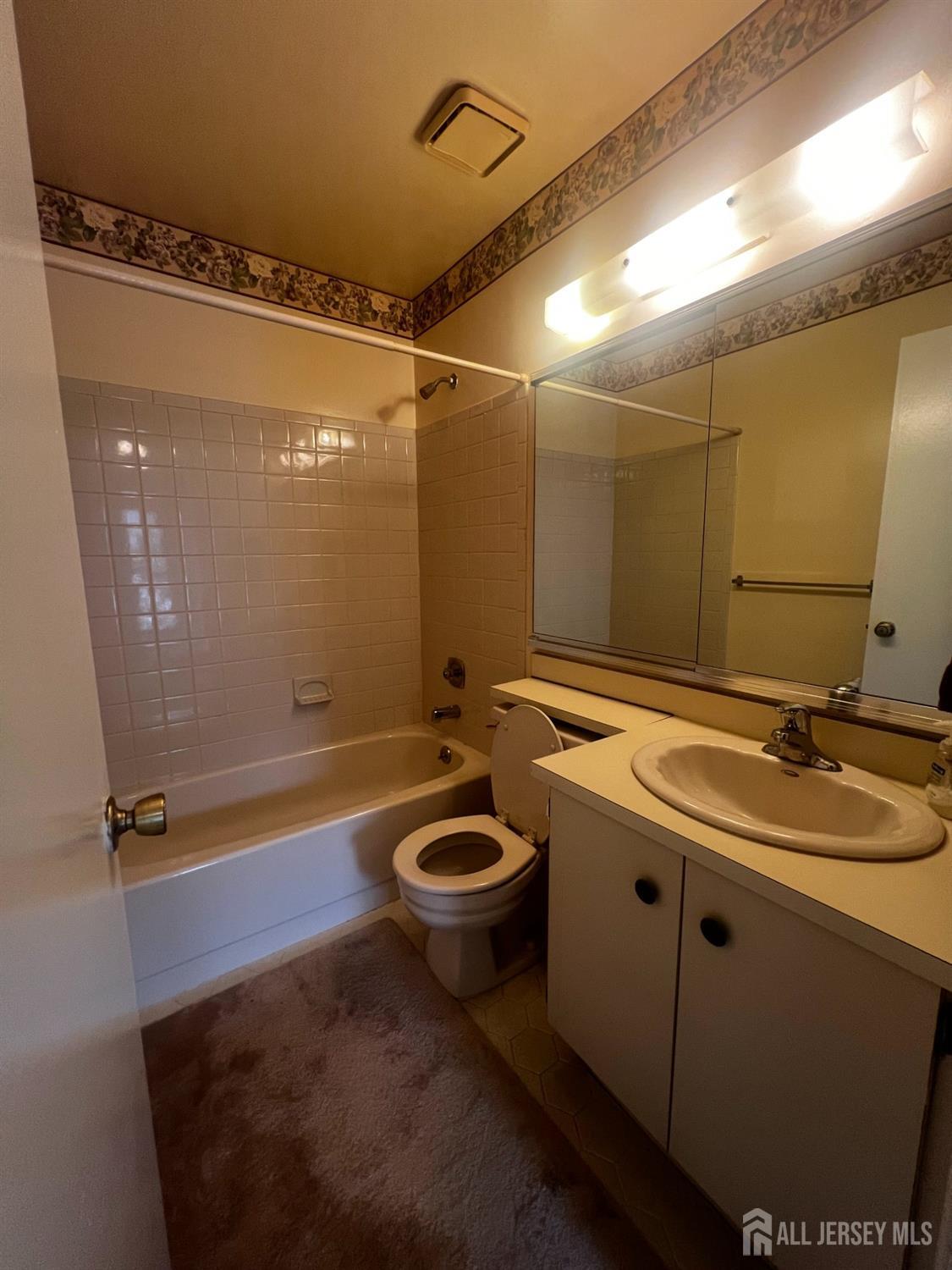 143 Archery Court Old Bridge, NJ 08857 - Photo 26 of 29 a bathroom with a granite countertop sink a toilet a mirror and shower