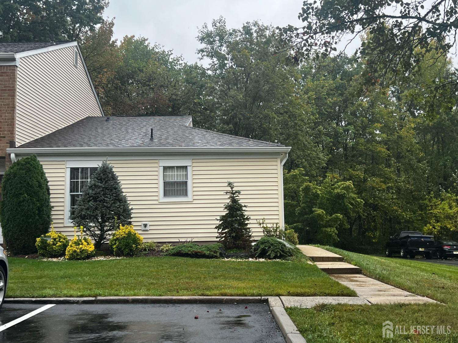 143 Archery Court Old Bridge, NJ 08857 - Photo 3 of 29 a front view of a house with a garden