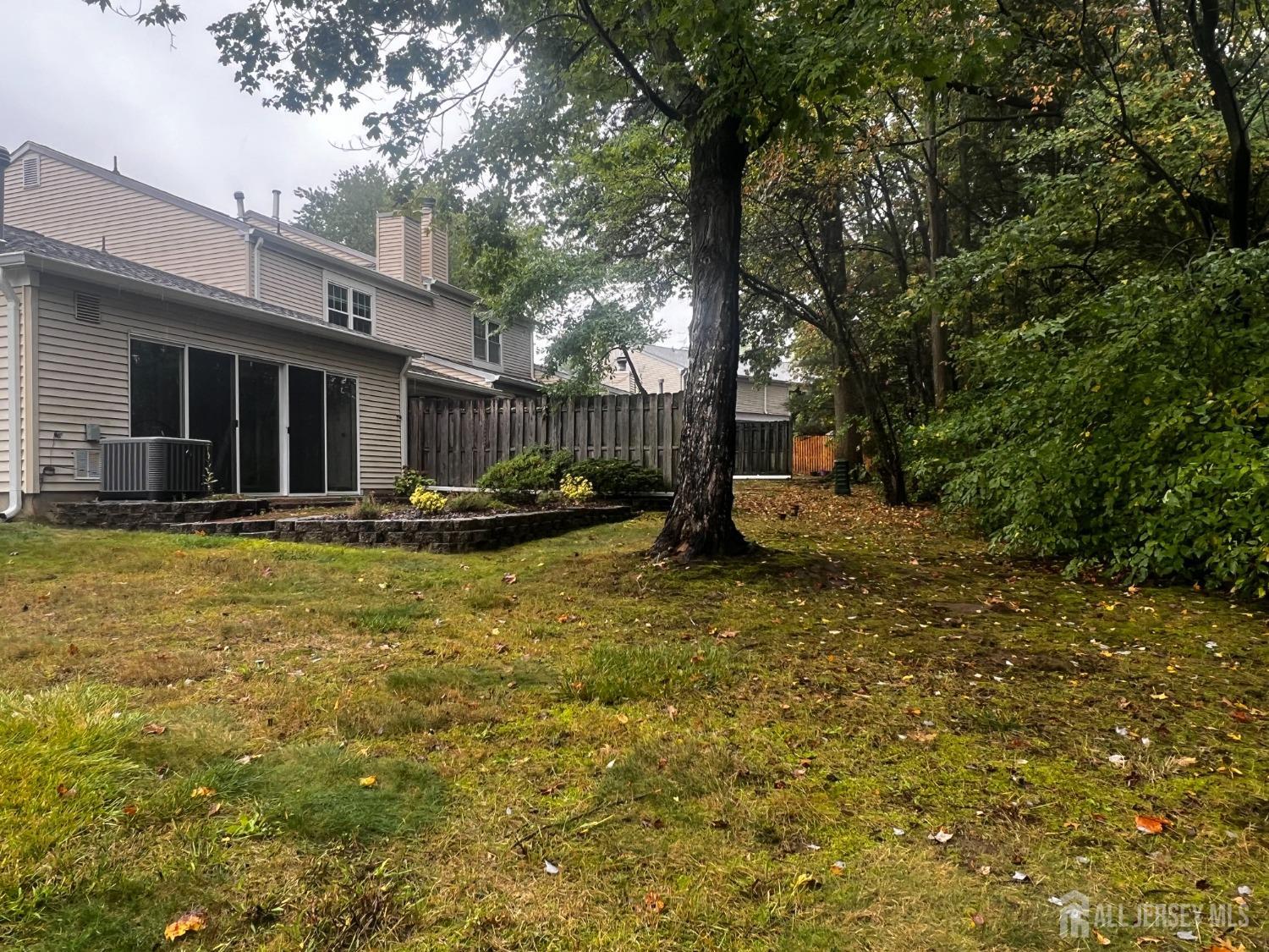143 Archery Court Old Bridge, NJ 08857 - Photo 4 of 29 a backyard of a house with yard table and chairs