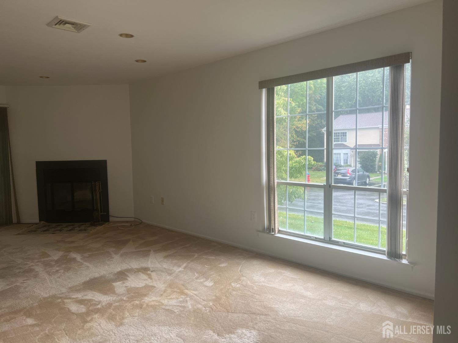 143 Archery Court Old Bridge, NJ 08857 - Photo 5 of 29 a view of an empty room with a window