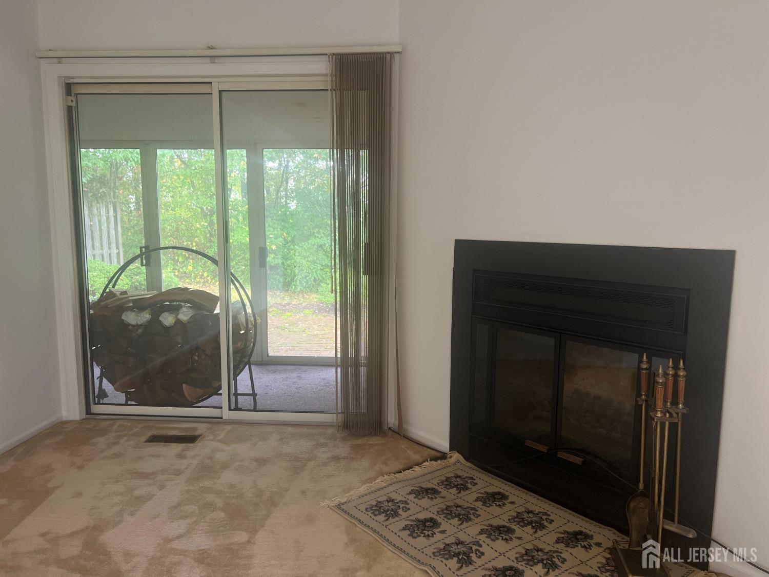 143 Archery Court Old Bridge, NJ 08857 - Photo 8 of 29 a view of a livingroom with a fireplace and a window