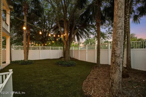 a bathroom with a granite countertop sink toilet a shower and a mirror
