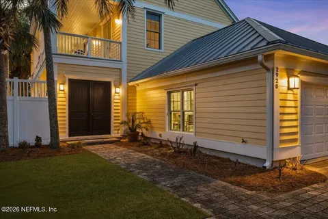 a kitchen with granite countertop white cabinets and stainless steel appliances