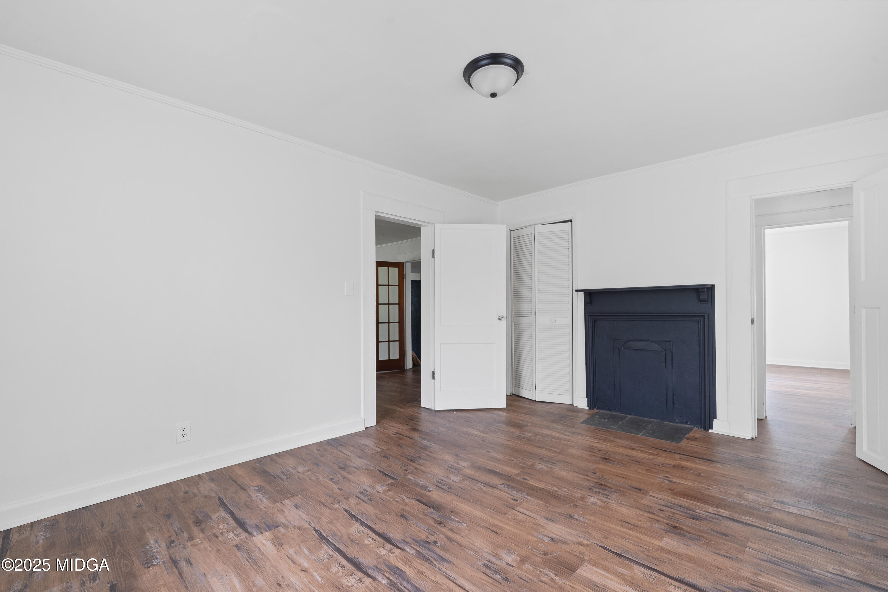 1512 Highway 22 Haddock, GA 31033 - Photo 13 of 32 a view of an empty room with wooden floor