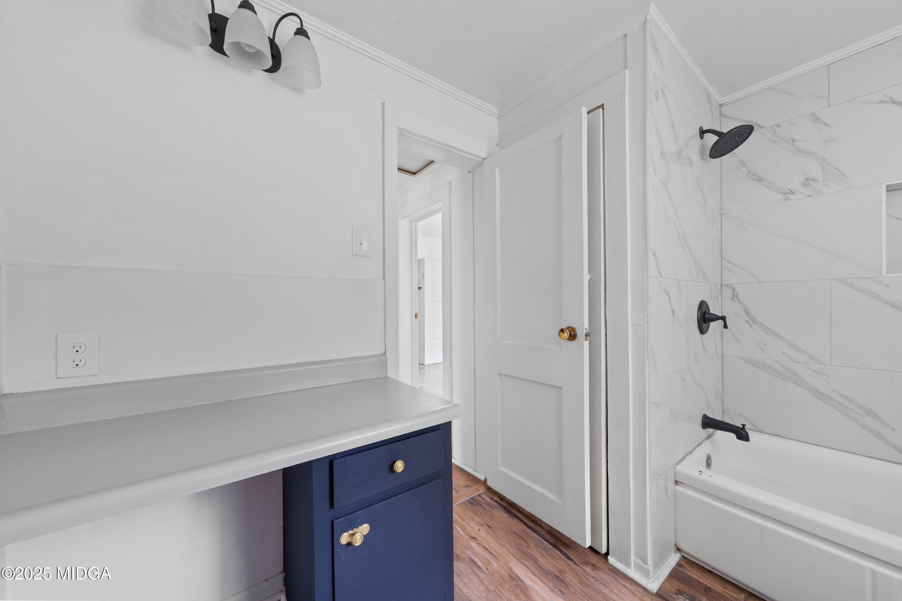 1512 Highway 22 Haddock, GA 31033 - Photo 15 of 32 a bathroom with a tub a sink and a shower