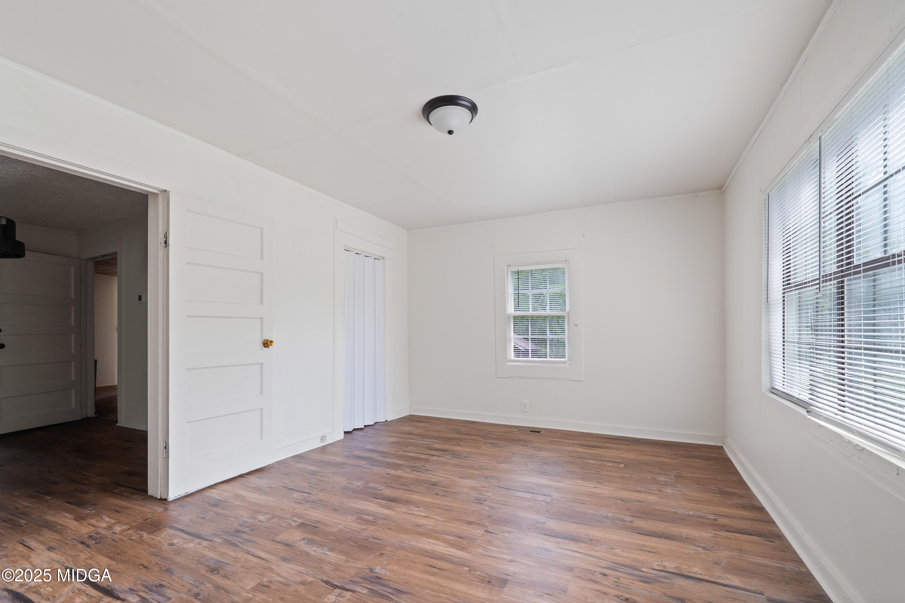 1512 Highway 22 Haddock, GA 31033 - Photo 16 of 32 an empty room with windows and closet