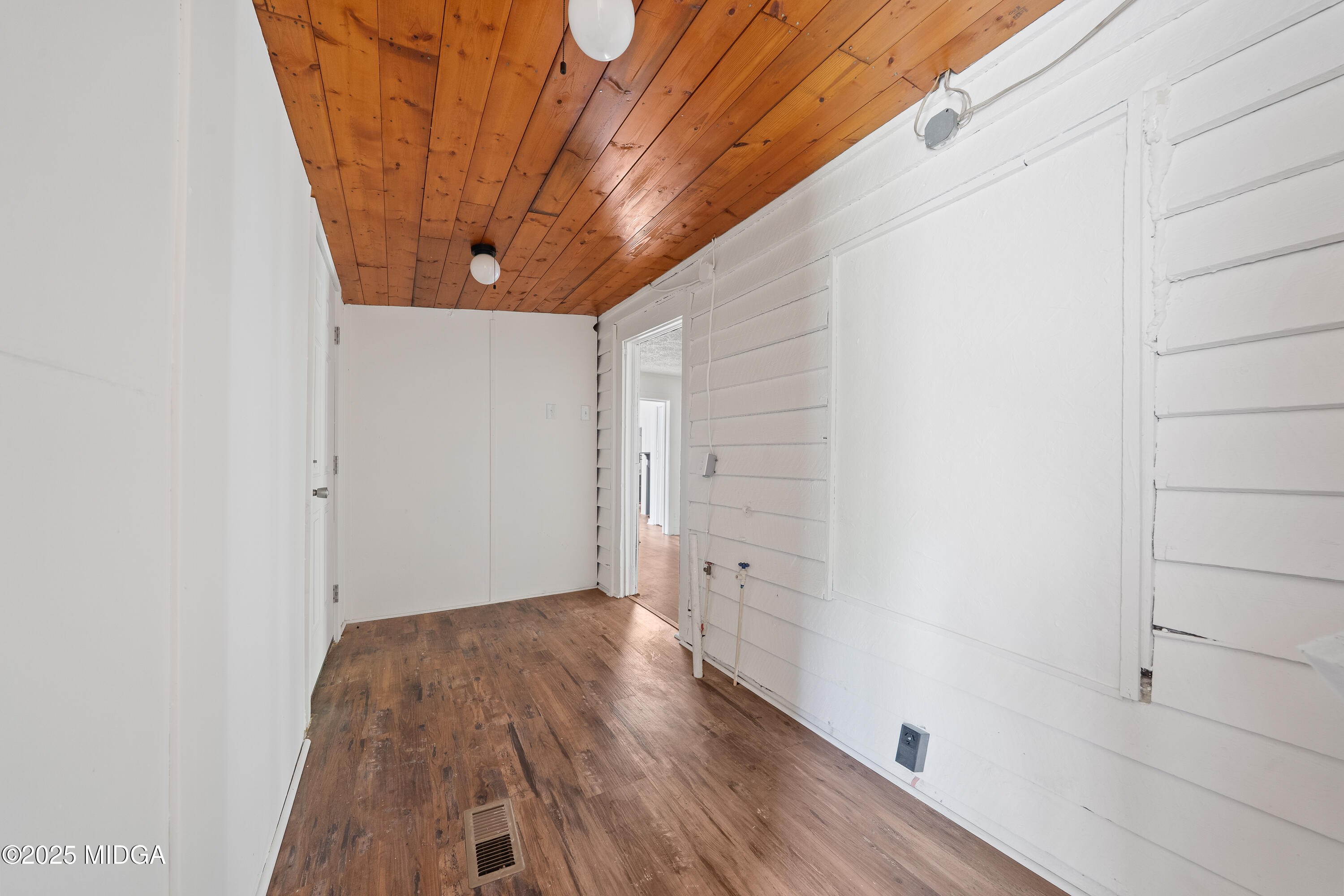 1512 Highway 22 Haddock, GA 31033 - Photo 19 of 32 a view of a room with wooden floor and small tree