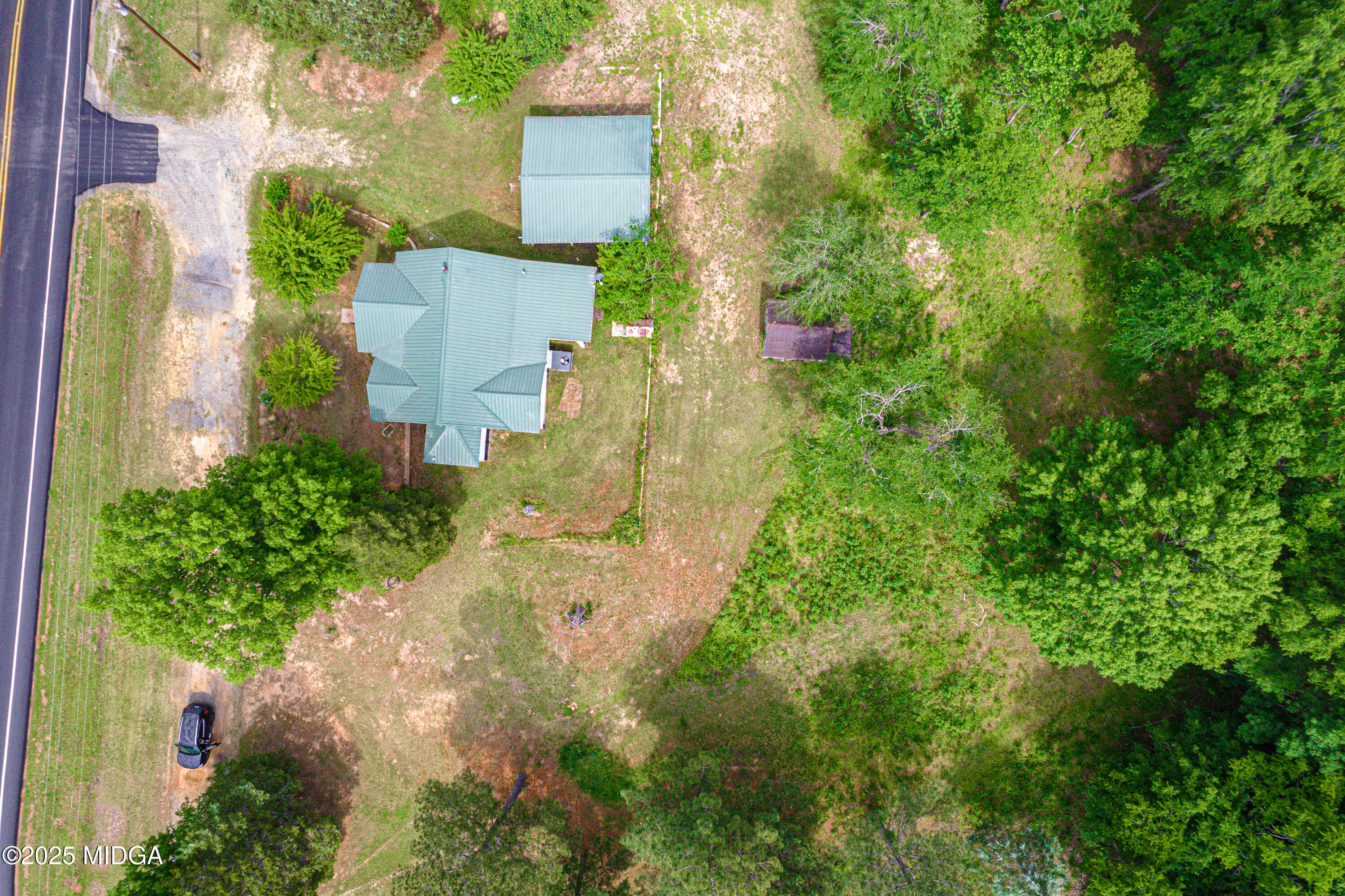 1512 Highway 22 Haddock, GA 31033 - Photo 27 of 32 an aerial view of residential house with outdoor space and trees all around