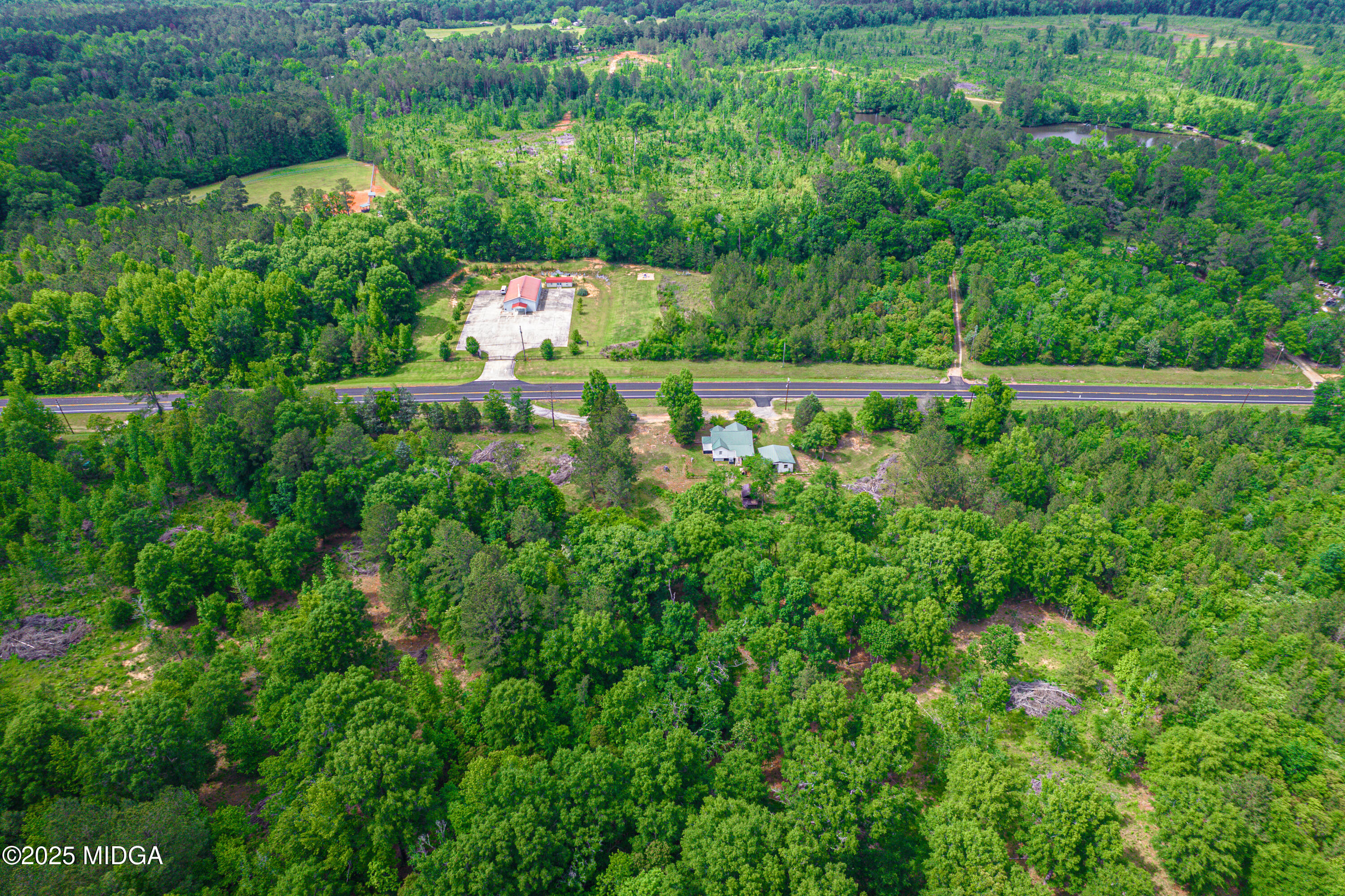 1512 Highway 22 Haddock, GA 31033 - Photo 28 of 32 a view of a garden with a lake