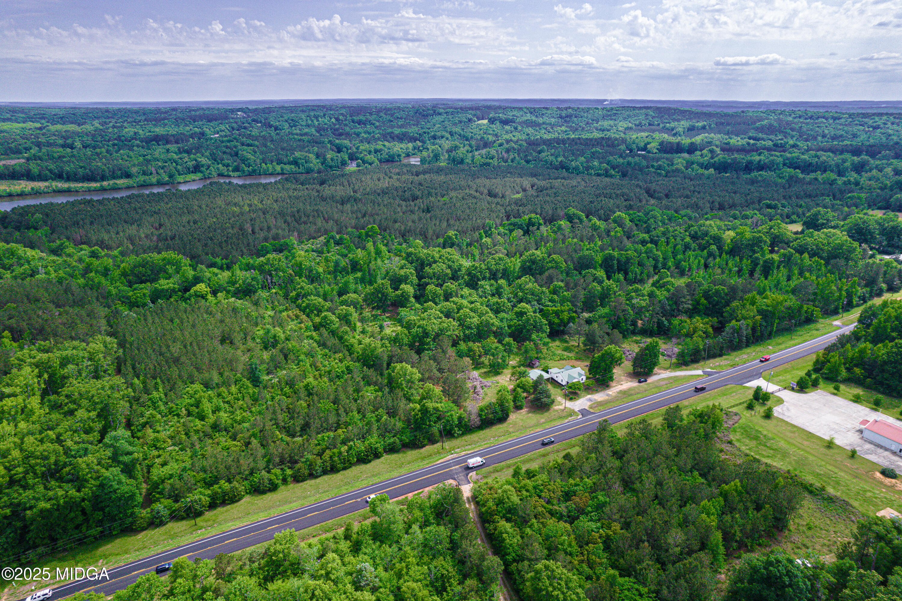 1512 Highway 22 Haddock, GA 31033 - Photo 29 of 32 a view of lake with green field