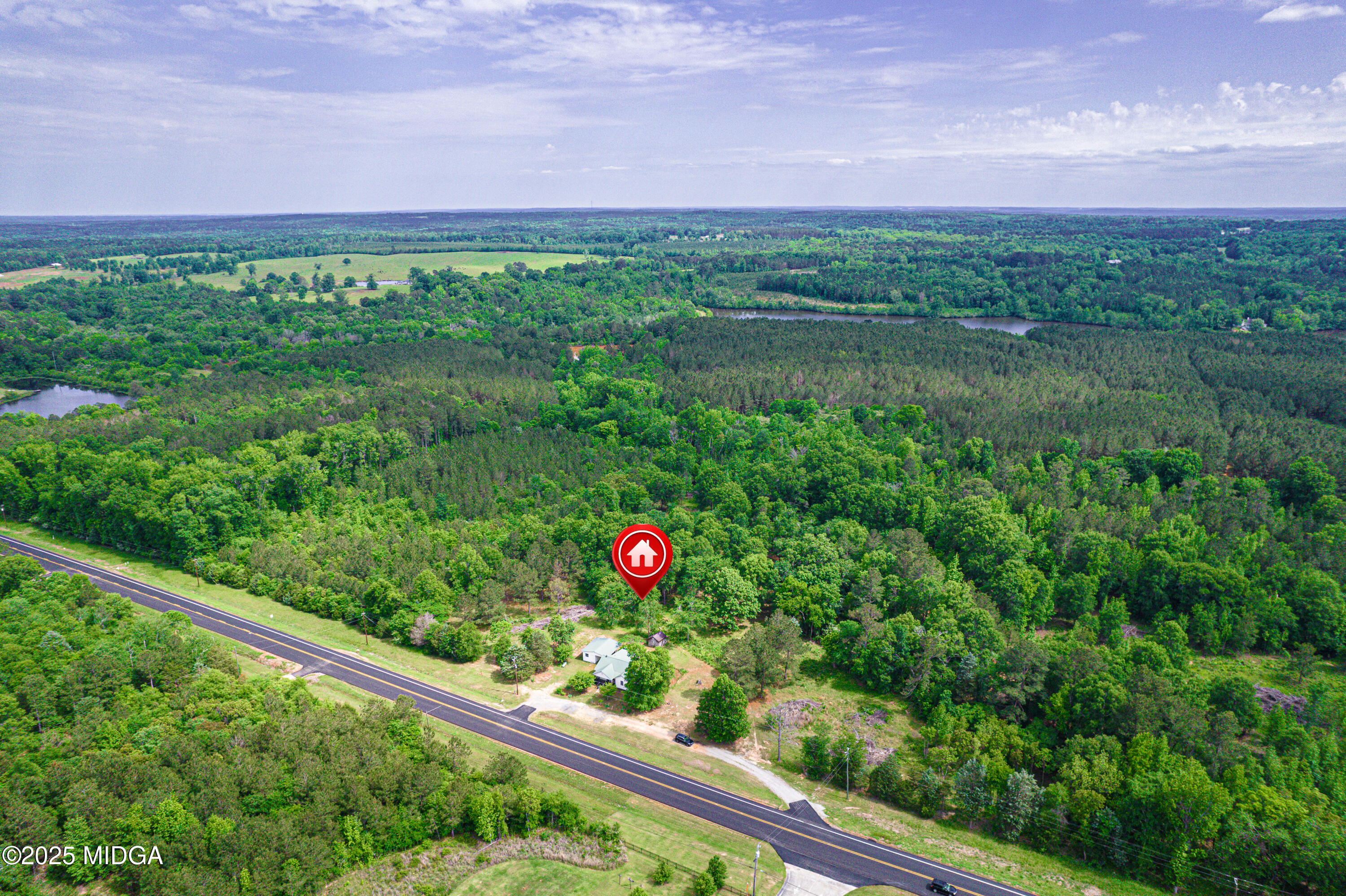 1512 Highway 22 Haddock, GA 31033 - Photo 31 of 32 a view of a back yard from a window