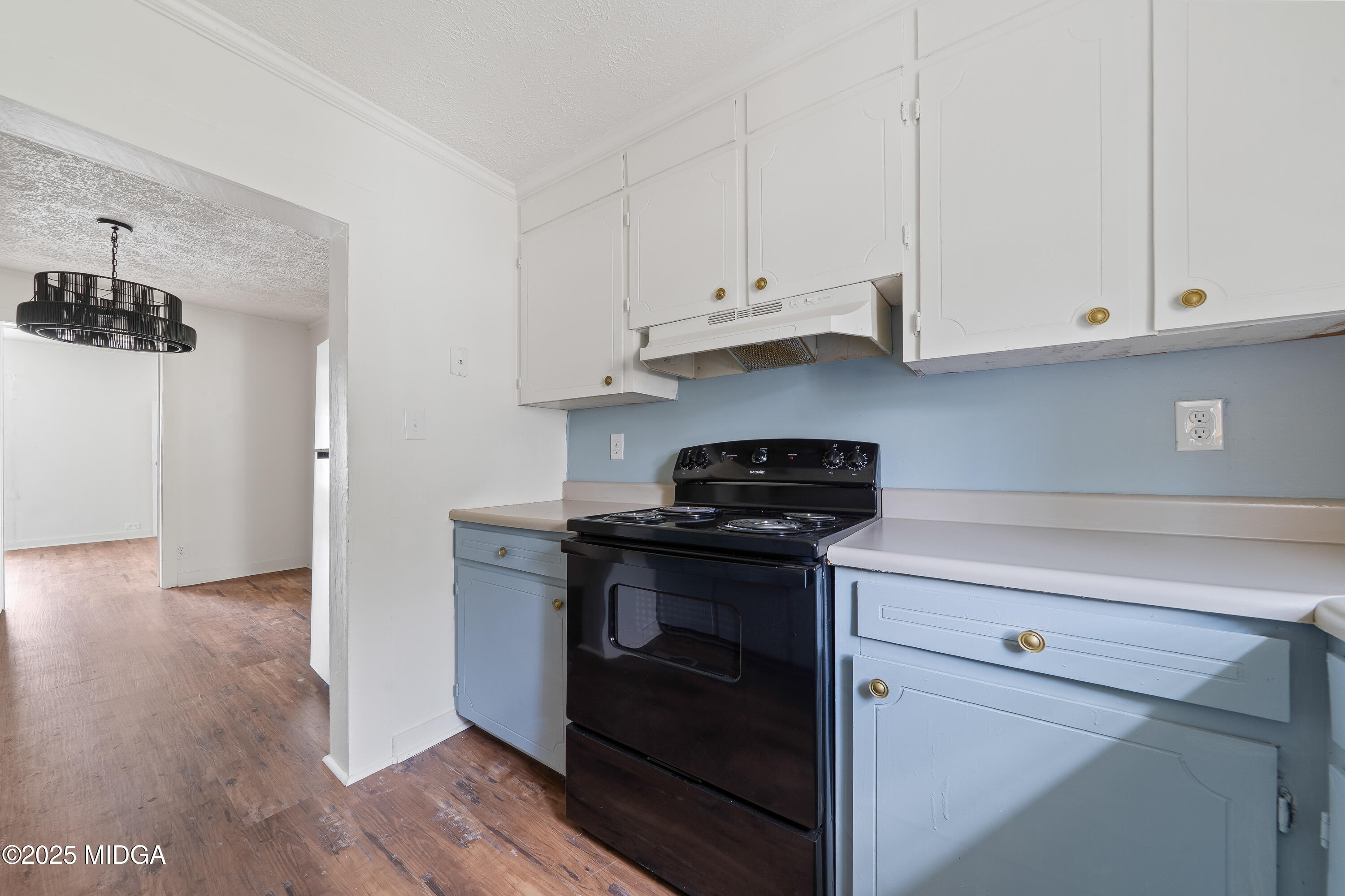 1512 Highway 22 Haddock, GA 31033 - Photo 7 of 32 a kitchen with stainless steel appliances granite countertop a stove a refrigerator and a white cabinets