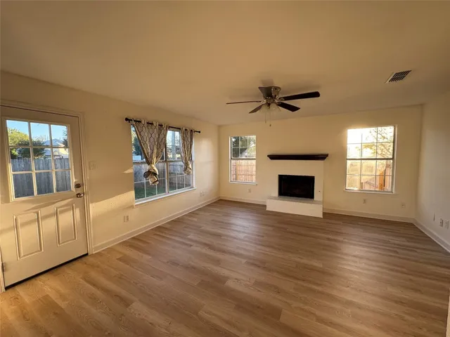 a kitchen with a sink cabinets stainless steel appliances and a window