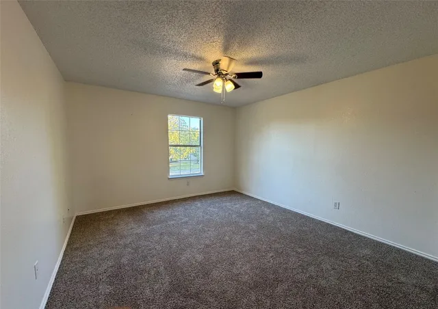 a view of a livingroom with stairs and furniture