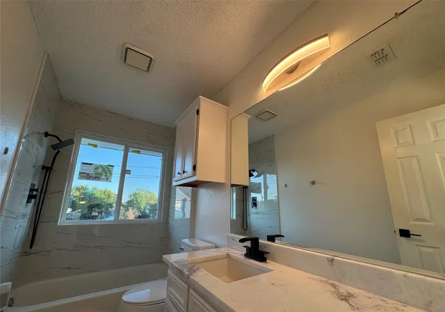 a bath tub sitting next to a window