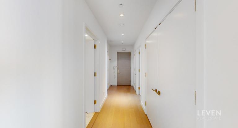 305 East 51st Street, Unit RU5A Manhattan, NY 10022 - Photo 14 of 15 a view of a hallway with a white walls