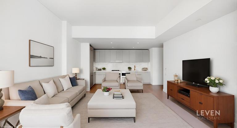 305 East 51st Street, Unit RU5A Manhattan, NY 10022 - Photo 4 of 15 a living room with furniture and a flat screen tv