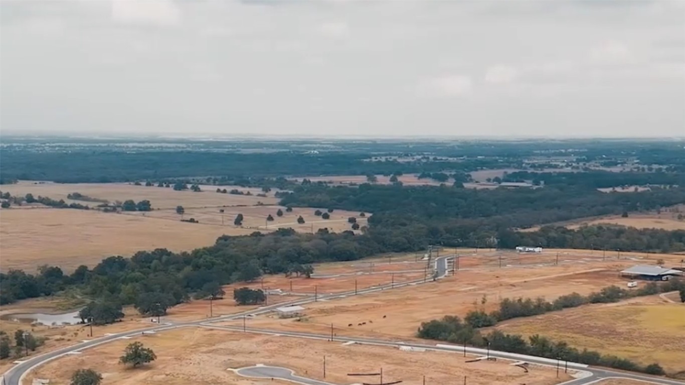 167 Palisade Road Elgin, TX 78621 - Photo 2 of 7 a view of a lake with beach