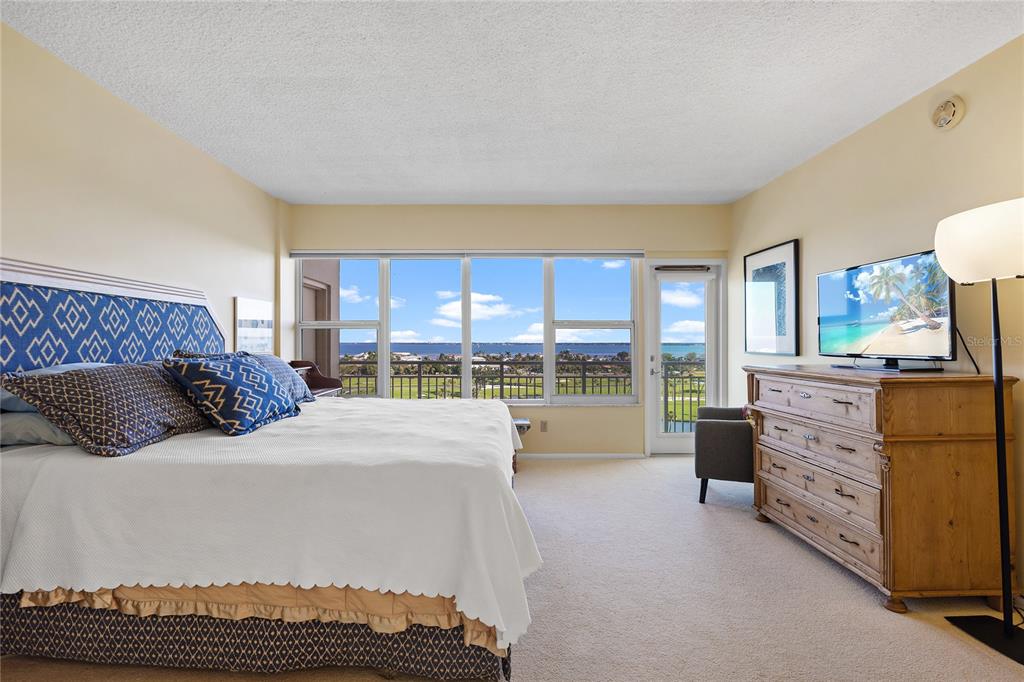 601 Longboat Club Road, Unit 902S Longboat Key, FL 34228 - Photo 15 of 65 a bedroom with a bed and large window