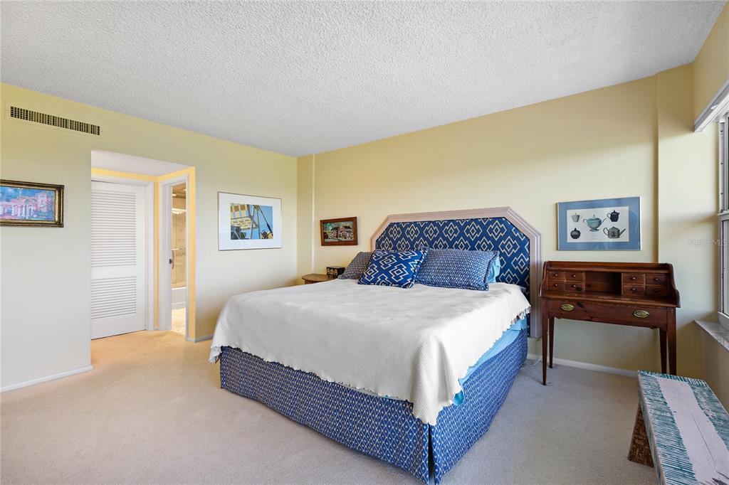 601 Longboat Club Road, Unit 902S Longboat Key, FL 34228 - Photo 17 of 65 a bedroom with a bed and dresser
