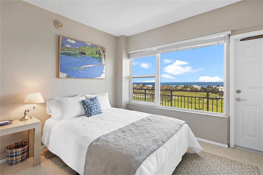 Undisclosed Address Longboat Key, FL 34228 - Photo 23 of 68 a bedroom with a bed and a large window