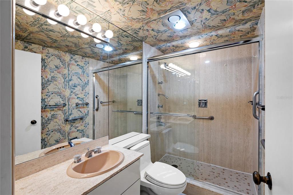 601 Longboat Club Road, Unit 902S Longboat Key, FL 34228 - Photo 23 of 65 a bathroom with a sink toilet and shower