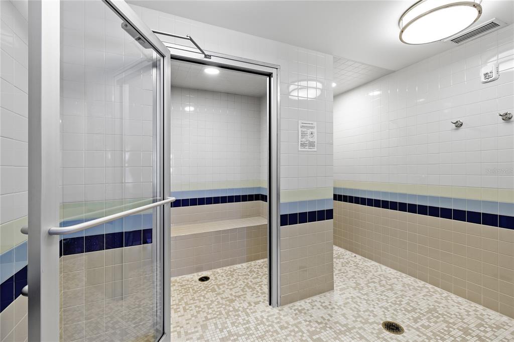 Undisclosed Address Longboat Key, FL 34228 - Photo 42 of 68 a bathroom with a shower and a mirror