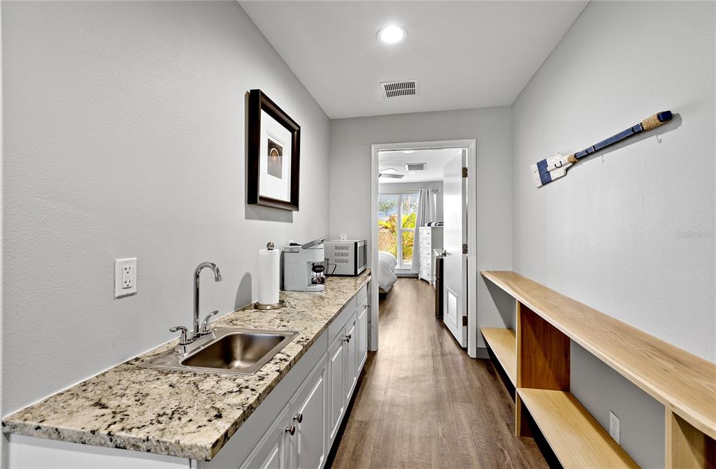 Undisclosed Address Longboat Key, FL 34228 - Photo 45 of 68 a kitchen with stainless steel appliances granite countertop a sink stove and refrigerator