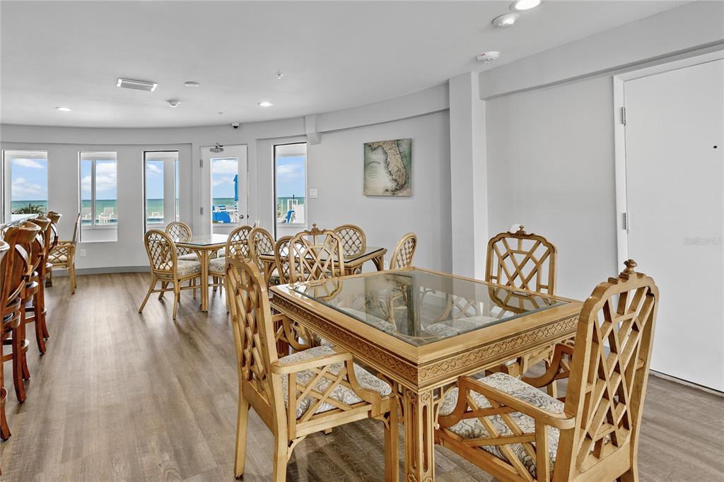 601 Longboat Club Road, Unit 902S Longboat Key, FL 34228 - Photo 47 of 65 a dining room with furniture and wooden floor