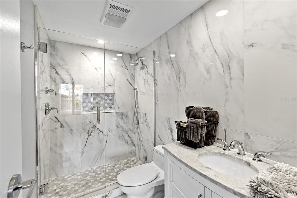 Undisclosed Address Longboat Key, FL 34228 - Photo 47 of 68 a bathroom with a granite countertop sink toilet and shower