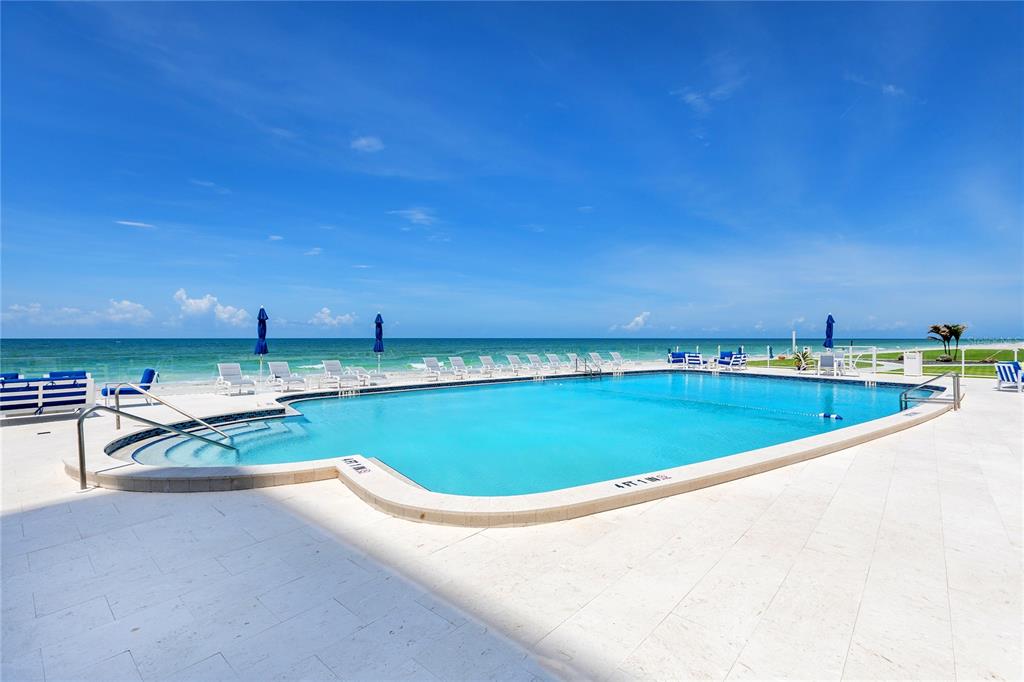 601 Longboat Club Road, Unit 902S Longboat Key, FL 34228 - Photo 62 of 65 a view of a swimming pool and an outdoor seating