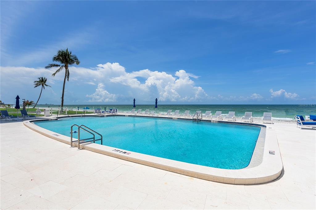 Undisclosed Address Longboat Key, FL 34228 - Photo 67 of 68 a view of a swimming pool and a yard