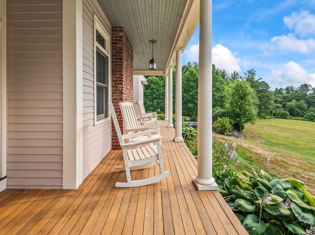 15 Stagecoach Road Princeton, MA 01541 - Photo 3 of 41 a view of a balcony with chair and wooden floor
