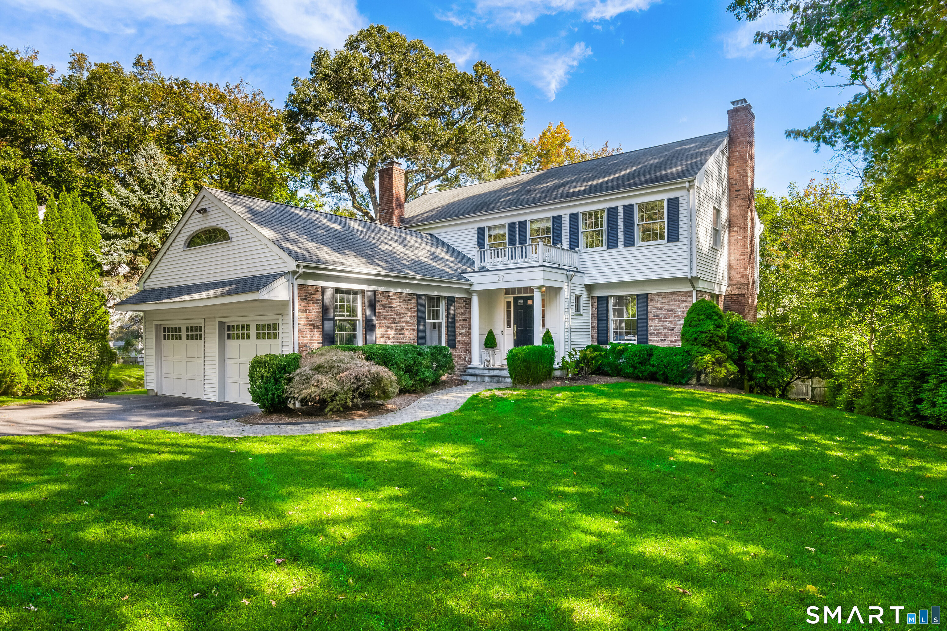 27 Point O Woods Road South Darien, CT 06820 - Photo 1 of 32 a front view of a house with a yard