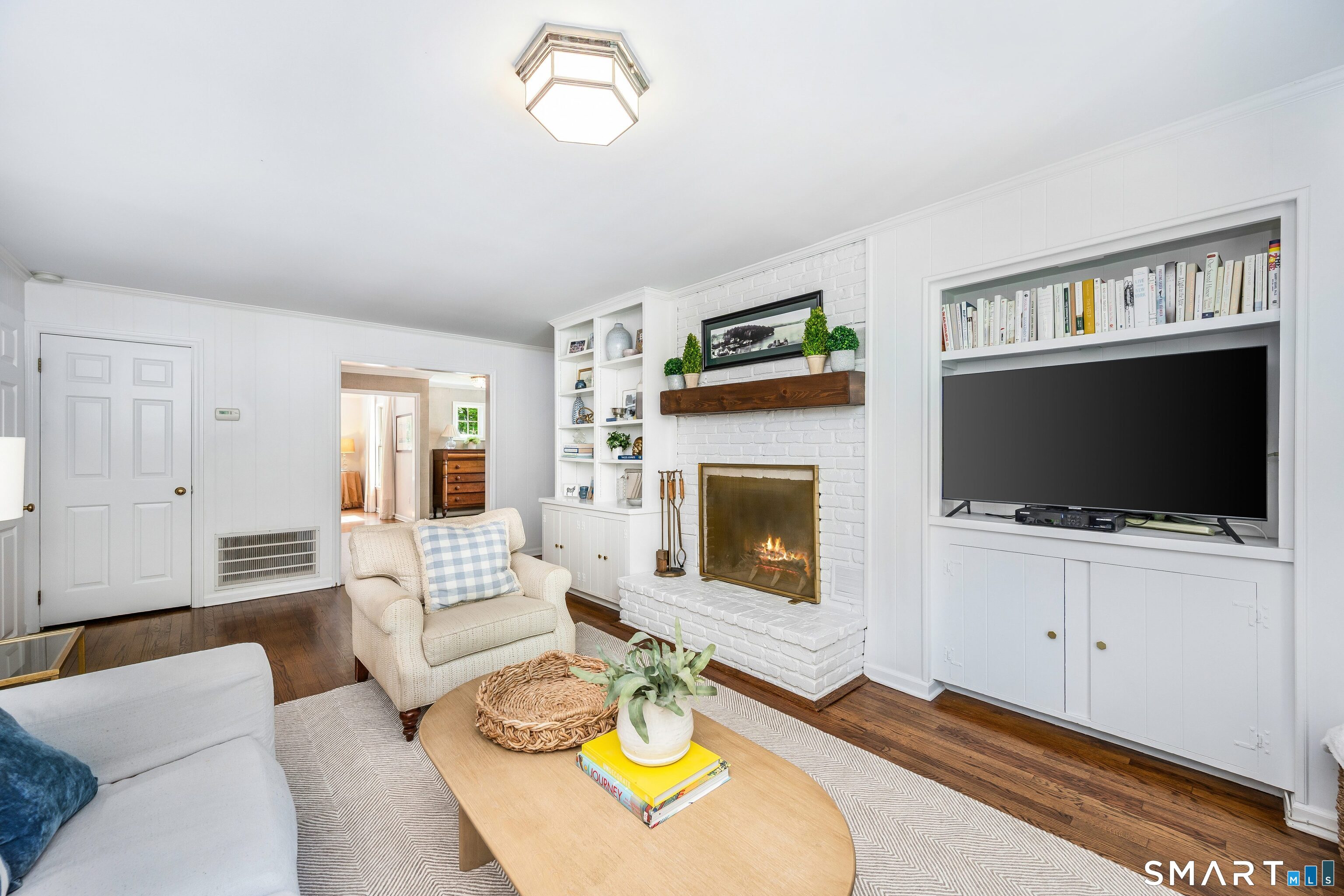 27 Point O Woods Road South Darien, CT 06820 - Photo 11 of 32 a living room with furniture and a flat screen tv