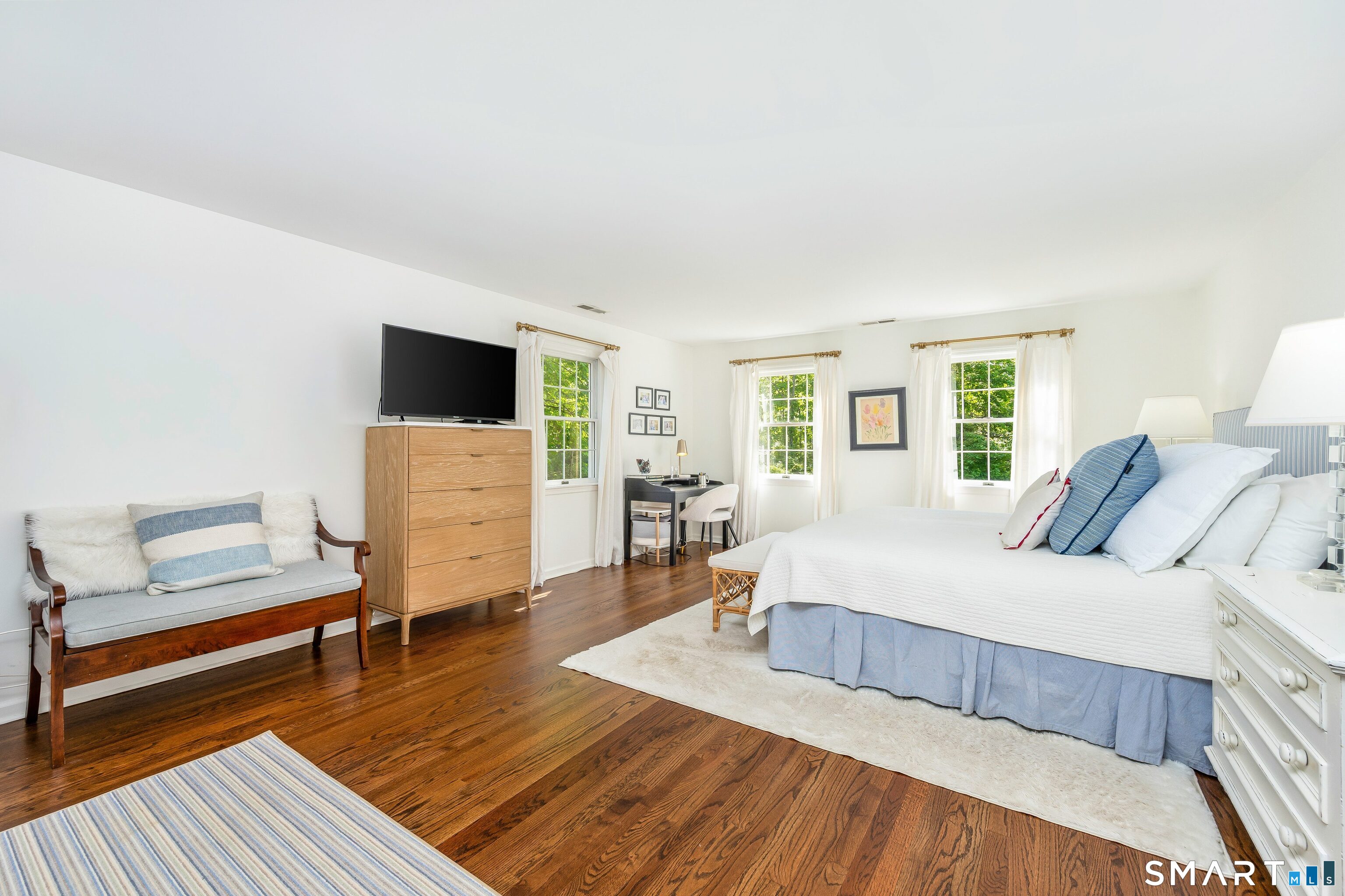 27 Point O Woods Road South Darien, CT 06820 - Photo 15 of 32 a bedroom with a bed and a couch