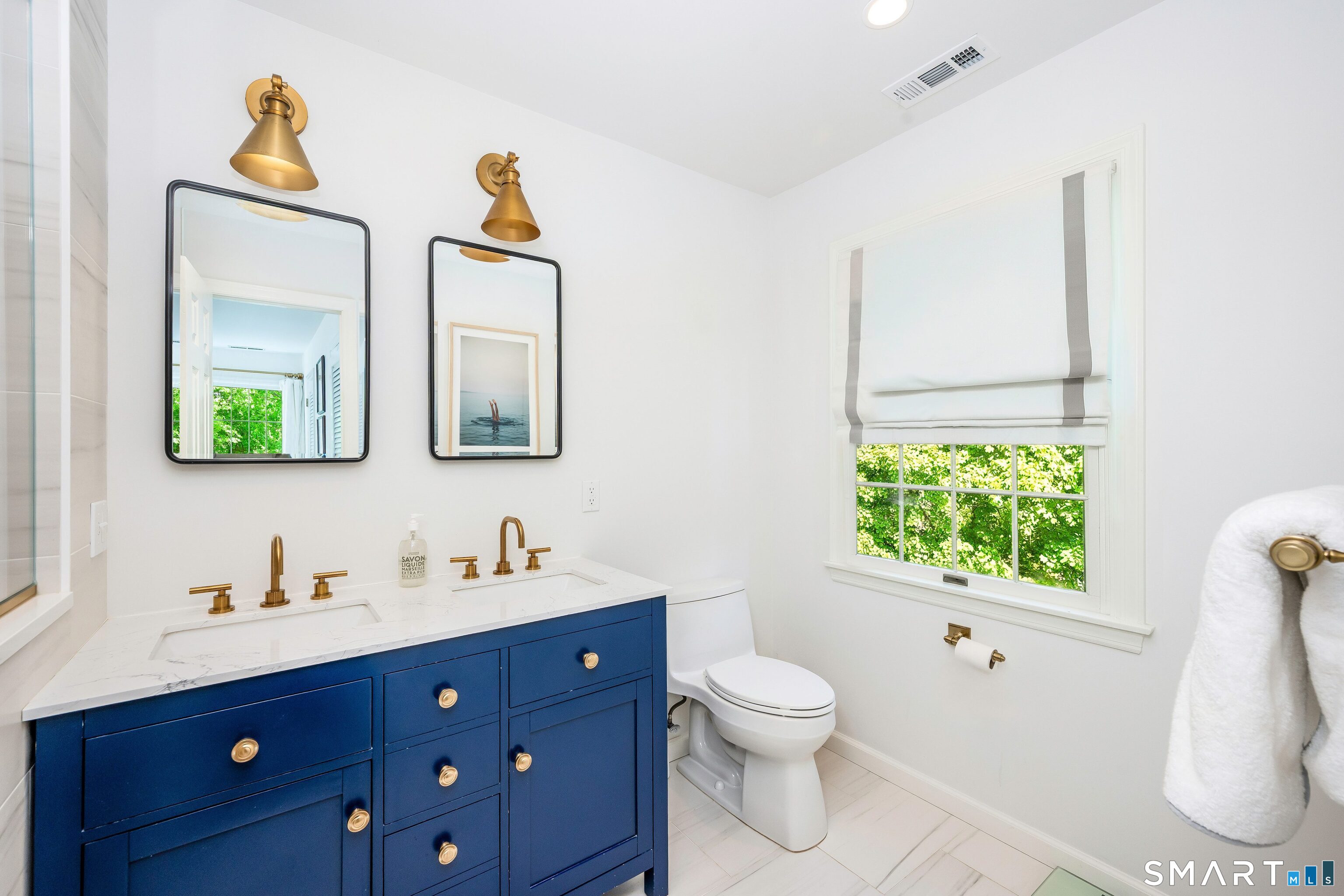 27 Point O Woods Road South Darien, CT 06820 - Photo 17 of 32 a bathroom with a toilet sink and mirror