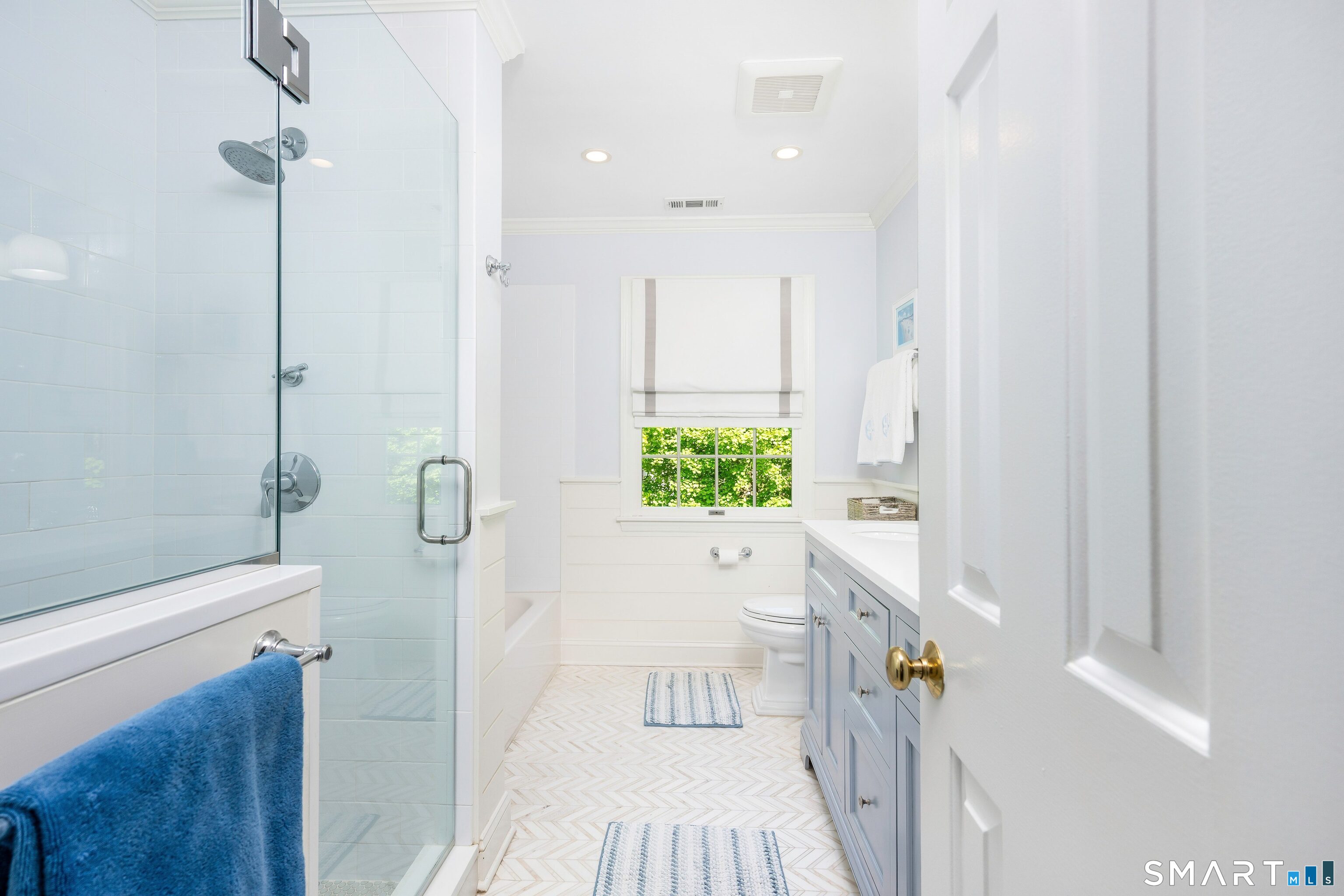 27 Point O Woods Road South Darien, CT 06820 - Photo 22 of 32 a bathroom with a sink a toilet and shower