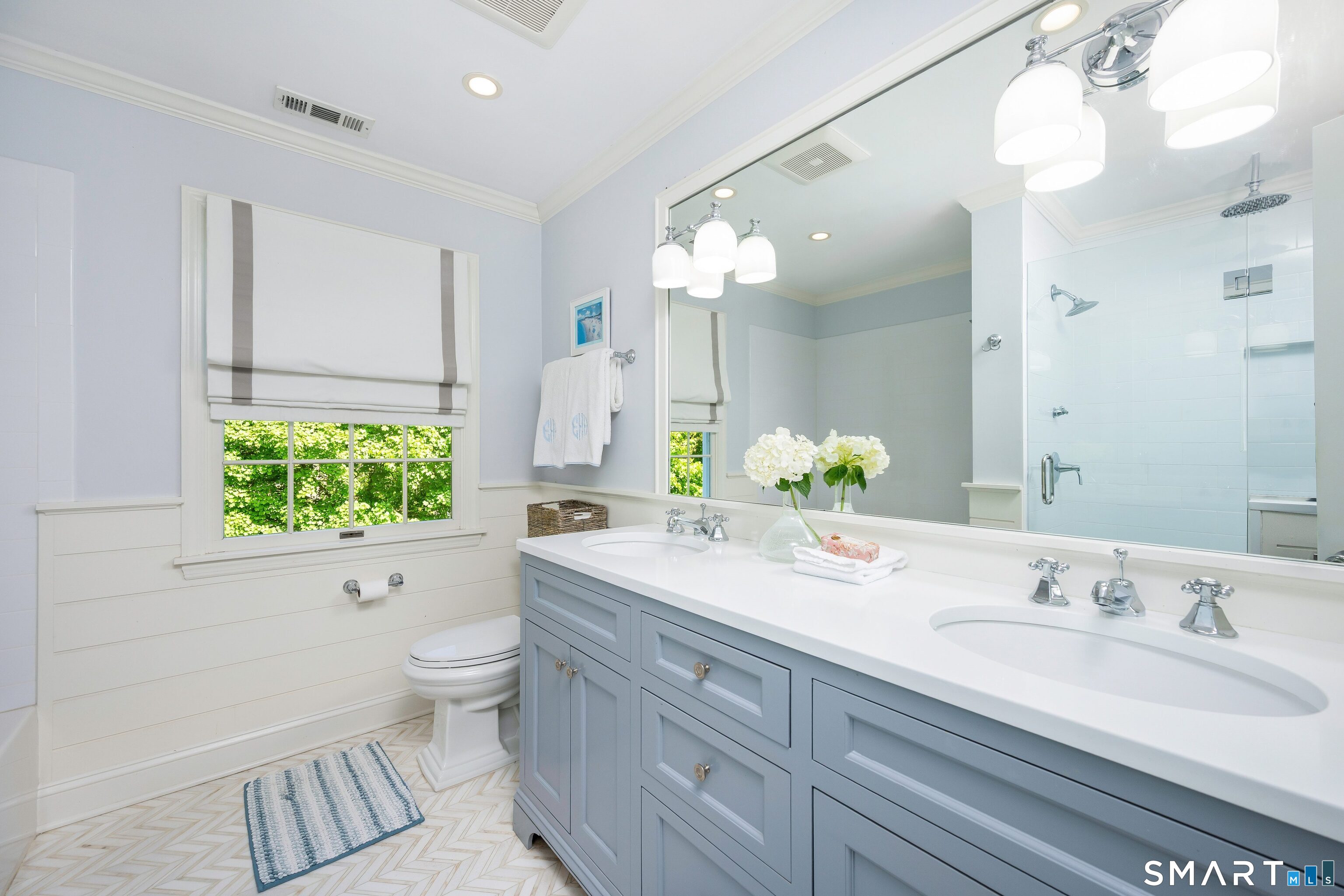 27 Point O Woods Road South Darien, CT 06820 - Photo 23 of 32 a bathroom with a granite countertop sink mirror and a bathtub