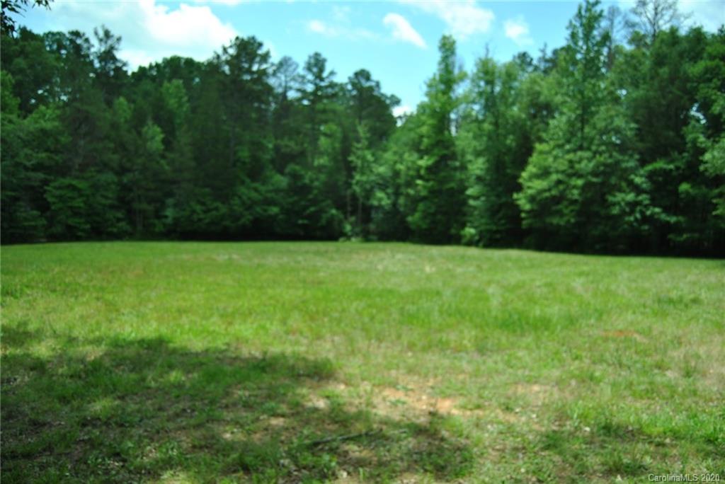 3502 Penshurst Road, Unit TRACT #11 Rock Hill, SC 29730 - Photo 4 of 10 a view of green field with trees in the background