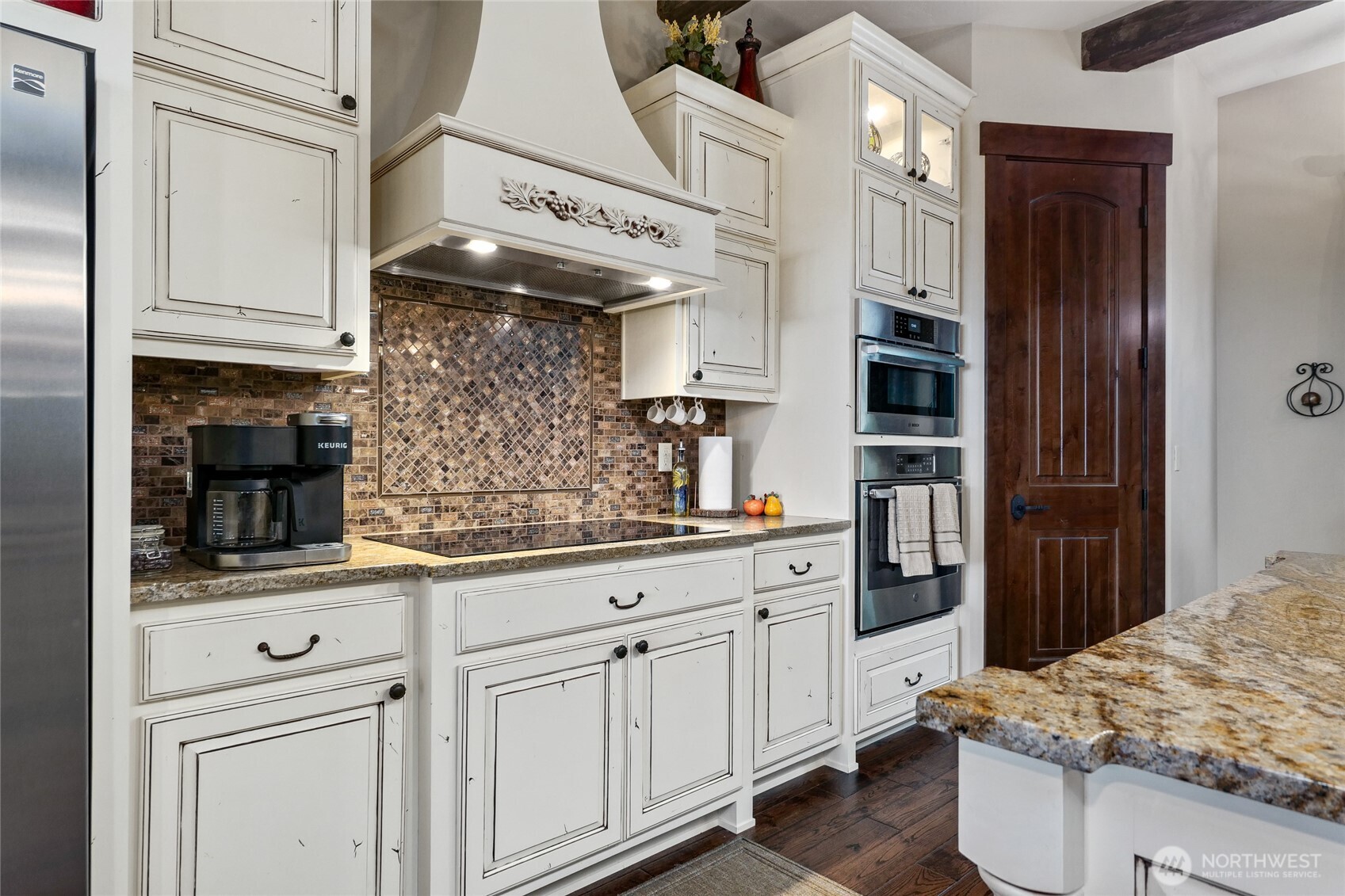 67 North Gilbertson Road Camano Island, WA 98282 - Photo 13 of 40 a kitchen with white cabinets and sink