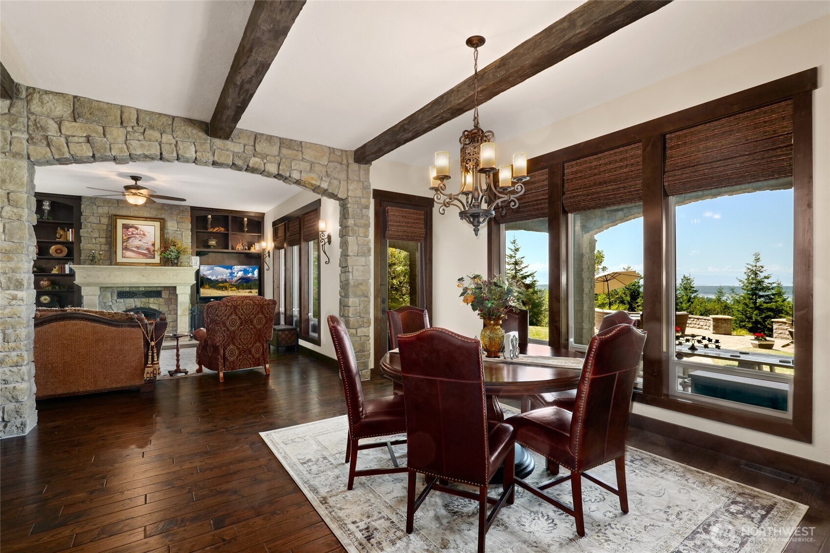 67 North Gilbertson Road Camano Island, WA 98282 - Photo 16 of 40 a dining room with furniture wooden floor and a chandelier