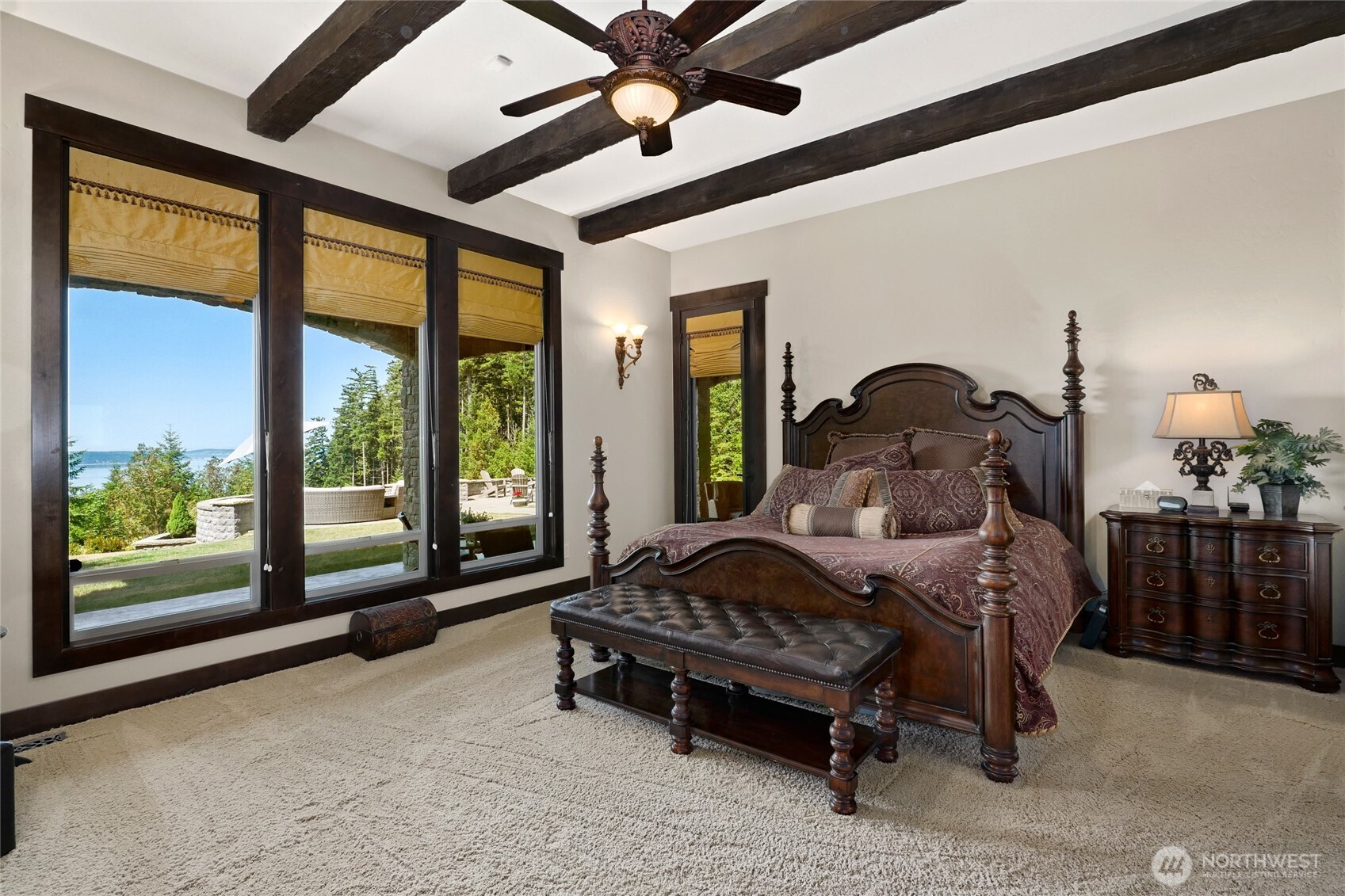 67 North Gilbertson Road Camano Island, WA 98282 - Photo 17 of 40 a bedroom with a bed and large windows