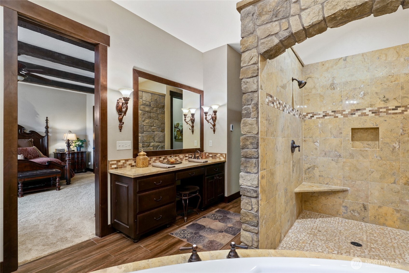 67 North Gilbertson Road Camano Island, WA 98282 - Photo 21 of 40 a bathroom with a granite countertop sink a mirror and shower