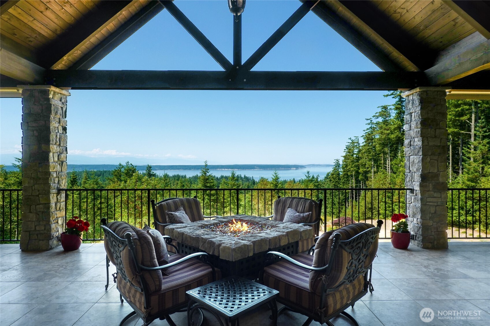 67 North Gilbertson Road Camano Island, WA 98282 - Photo 25 of 40 a view of a roof deck with couches and wooden floor