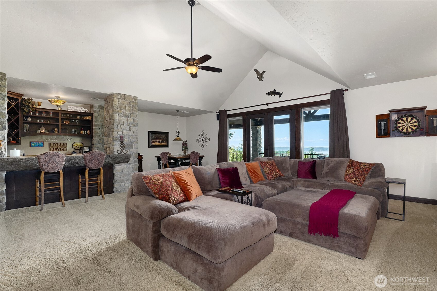 67 North Gilbertson Road Camano Island, WA 98282 - Photo 26 of 40 a living room with furniture kitchen view and a large window