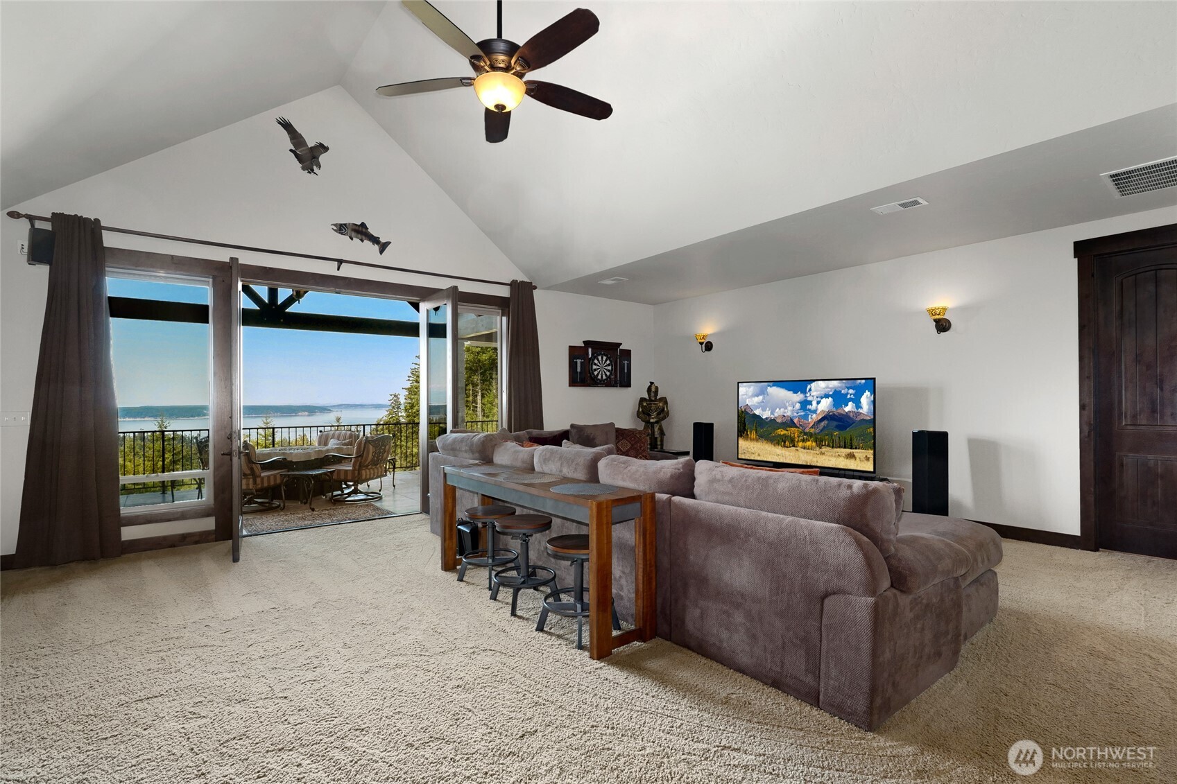 67 North Gilbertson Road Camano Island, WA 98282 - Photo 28 of 40 a living room with furniture and a flat screen tv