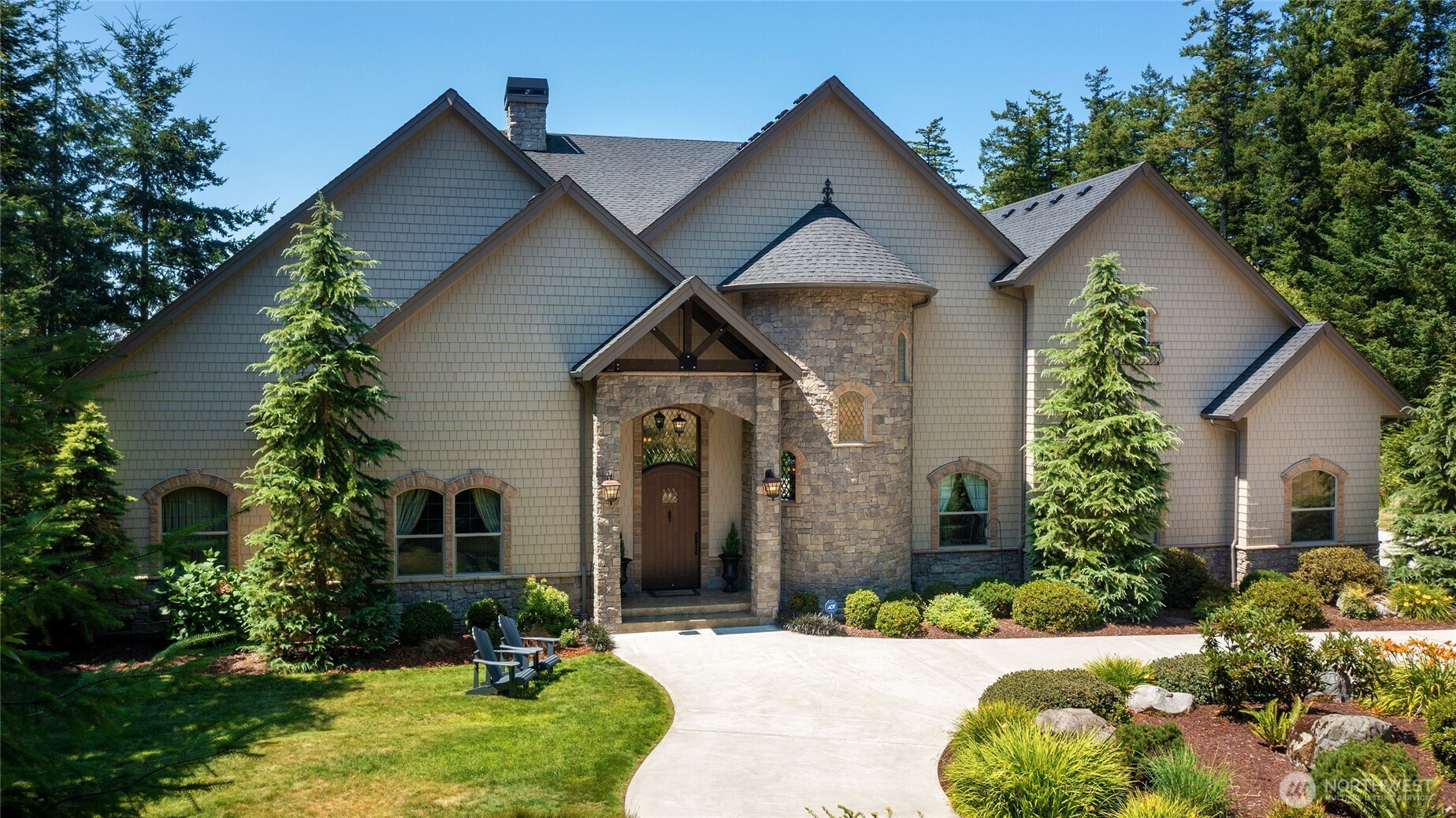 67 North Gilbertson Road Camano Island, WA 98282 - Photo 3 of 40 a front view of a house with garden