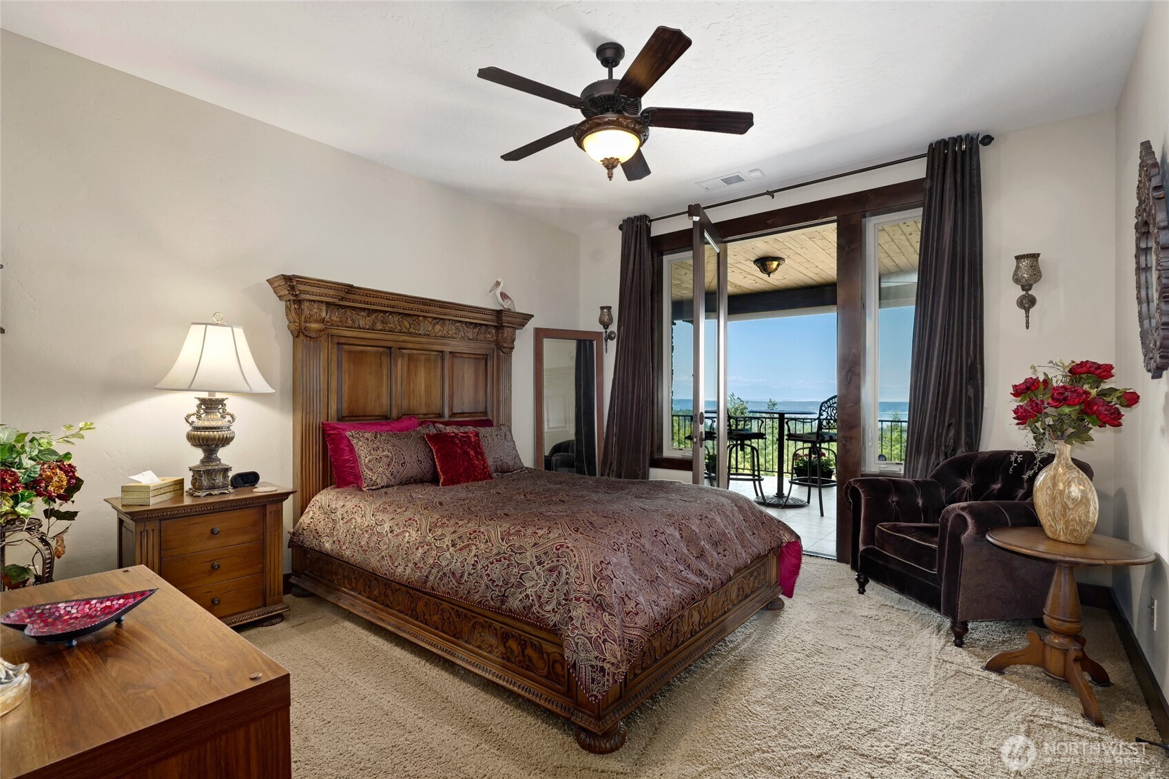 67 North Gilbertson Road Camano Island, WA 98282 - Photo 31 of 40 a bedroom with a bed and a chandelier